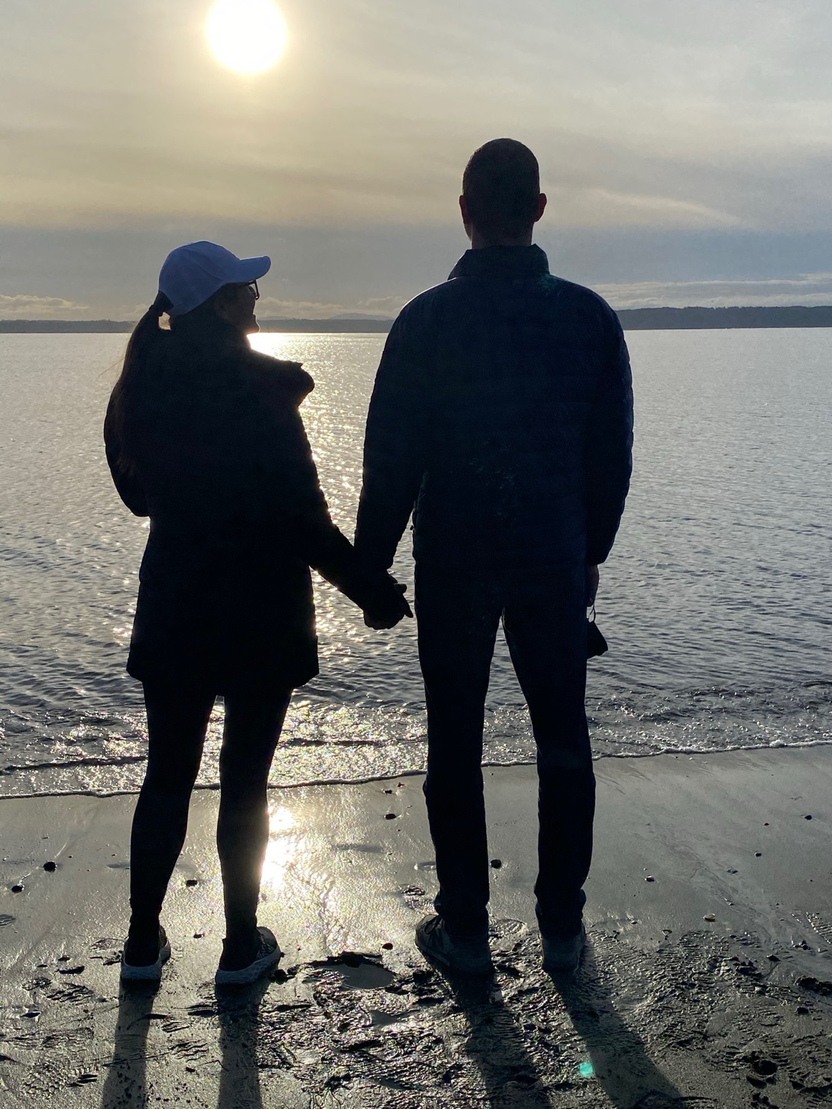 Jesse and Mari Bond on the beach at sunset